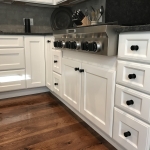 cooktop and white cabinets