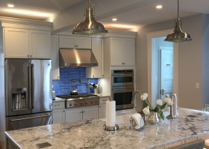 white kitchen with blue tile backsplash