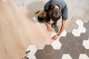 Installing flooring in a room using assorted tiles