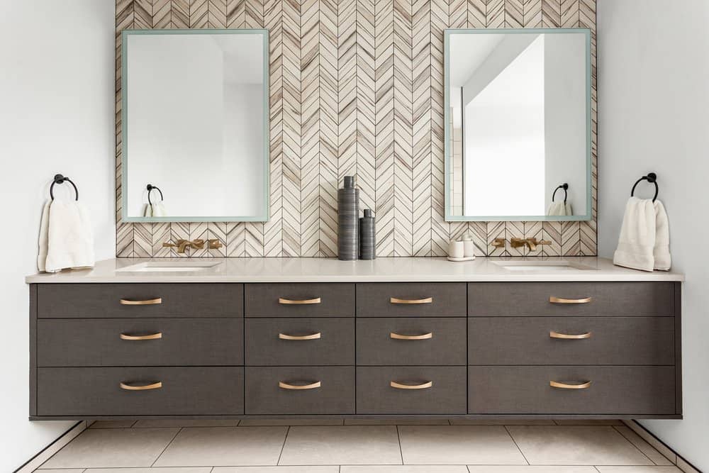 double bathroom vanity and sink combination with dark wood drawers and storage to increase usable space in bathroom for living entertaining and cleaning for big or small family homes during a renovation with square rectangle mirrors and decor