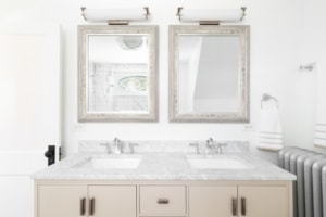 double custom vanity with a marble countertop in a master or guest bathroom built during a remodel renovation