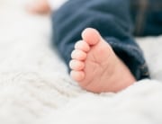 baby foot from a growing family who needs to renovate their home to make it more functional and safe for the newborn