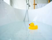 rubber duck floating in a bathtub soaking tub instead of a jetted whirlpool tub