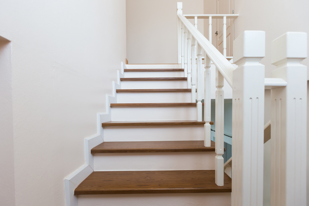 straight staircase in home built during renovation with professional
