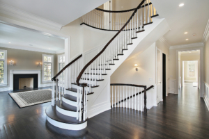 curved staircase in a home for increased elegance and design to increase value and appeal of home when renovating